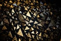 Golden triangles on a black textured background with a shimmering metallic effect