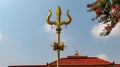 Golden trident or trishula. Royalty Free Stock Photo