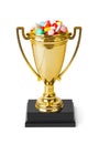 Golden trophy cup with pills