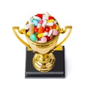 Golden trophy cup with pills