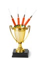 Golden trophy cup and syringes