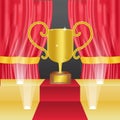 Golden trophy for winning announcement template on the stage with red curtai