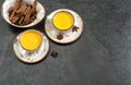 Golden turmeric curcuma milk drink dark stone background