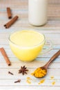 Golden turmeric milk with cinnamon. Healthy and aromatic detox b