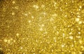 Golden twinkle abstract background with bokeh defocused lights Royalty Free Stock Photo