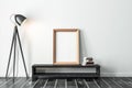 Golden vertical Frame Mockup standing on the console with modern floor lamp