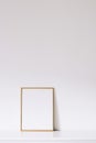 Golden vertical frame on white furniture, luxury home decor and design for mockup creation