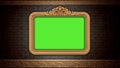 Golden vintage frame on brick wall. Design retro element. Green screen Royalty Free Stock Photo