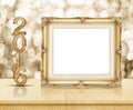 Golden Vintage frame with 2016 year wood texture with sparkling