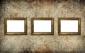 Golden vintage picture frame set with blank space on an old wall Royalty Free Stock Photo