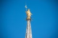 Golden Virgin Mary statue on top roof of Duomo Royalty Free Stock Photo