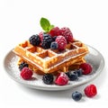 Golden Waffles Stacked High with Fresh Berries and Mint on a White Plate Royalty Free Stock Photo