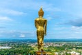 Golden walking Buddha statue in Nan, Thailand