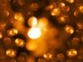 Golden warm color festive sparkling defocused light overlay Orange and yellow bokeh abstract backdrop Christmas New Year Royalty Free Stock Photo