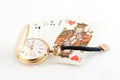 Golden watch and playing cards Royalty Free Stock Photo