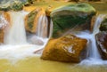 Water streams, orange sand with sediments below. river with red stones Royalty Free Stock Photo