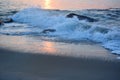 Golden Waves Along the Jetty at Sunrise Royalty Free Stock Photo