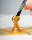 Golden wax terp sauce, cannabis thc dab resin on paper