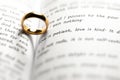 Golden wedding ring on bible book Royalty Free Stock Photo