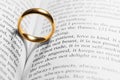 Golden wedding ring on bible book Royalty Free Stock Photo