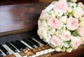 Wedding Rings on a piano keyboard and Flowers Royalty Free Stock Photo