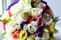 Golden wedding rings on beautiful colorful bridal bouquet Royalty Free Stock Photo