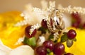 Golden wedding rings with diamonds on wedding bouquet of yellow flowers Royalty Free Stock Photo