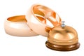 Golden wedding rings with reception bell. 3D rendering Royalty Free Stock Photo