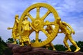 Golden Wheel of Dhamma on sky clouds