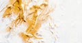 Golden and white oil paint on artist canvas. Fine art gold acrylic color closeup. Abstract creative background texture Royalty Free Stock Photo