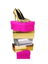 Golden Woman Shoes high heel on top of stacked boxes isolated Royalty Free Stock Photo