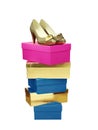 Golden Woman Shoes on top of stacked boxes isolated