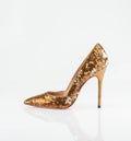 Golden women shoe Royalty Free Stock Photo