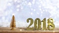 Golden 2018 on a wooden surface, Christmas snowy bokeh background Royalty Free Stock Photo