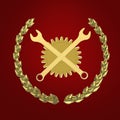 Golden wrenches crossed in front of gearwheel isolated on red background bottom view