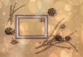 Golden Xmas composition with bronzed larch twigs, cones, berries and frame on golden background with bokeh and stars