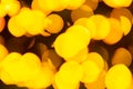 Golden yellow abstract background with bokeh defocused blurred lights. Royalty Free Stock Photo