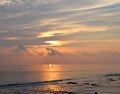 Golden Yellow Colors in Morning Sky with Reflection in Sea Water at Serene Beach - Natural Skyscape Background Royalty Free Stock Photo