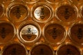 Golden yellow honey in glass jar on wooden board Closeup Copy space with bee logo