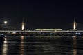 Goldenhorn and metro bridge view at dusk with full moon in istanbul at winter season.