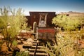 Goldfield Gold Mine`s old dangerous entrance to a gold mine shaft with trolley and rails leading inside Royalty Free Stock Photo