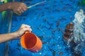 Goldfish scooping with kids on Annual festival. Royalty Free Stock Photo