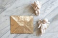 goldleaf envelope on marble with cupid figurine