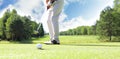 Golf approach shot with iron from fairway at sunny day Royalty Free Stock Photo
