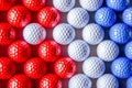 Pattern of golf balls coated in the tricolors of the French flag Royalty Free Stock Photo