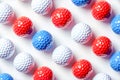 Pattern of golf balls coated in the tricolors of the French flag on white background Royalty Free Stock Photo