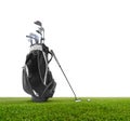 Golf bag ,golf ball and face balanced putter with Super Stroke putter grip on green isolated on white background Royalty Free Stock Photo