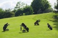 Golf bag caddy carrier motorcycle four nobody course Royalty Free Stock Photo
