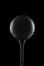 Golf ball on black background Royalty Free Stock Photo