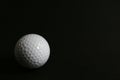 Golf ball on black background Royalty Free Stock Photo